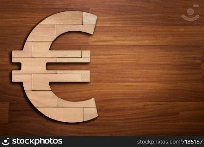 Wooden silhouette of euro sign