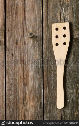 Wooden spatula on rustic background