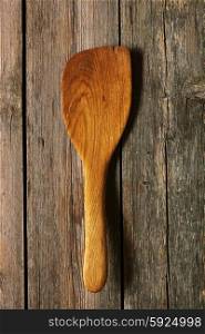 Wooden spatula on rustic background