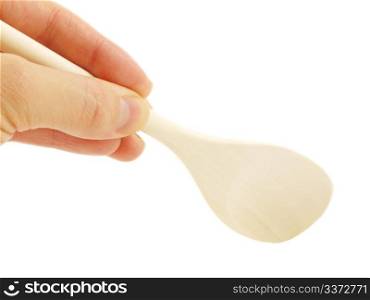 Wooden spatula. Person holding a wooden spatula, isolated towards white background