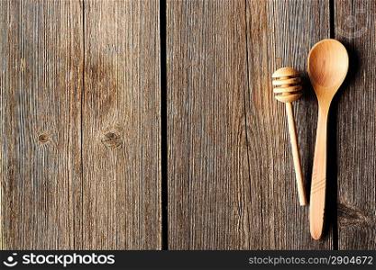 Wooden spoon and dipper on table