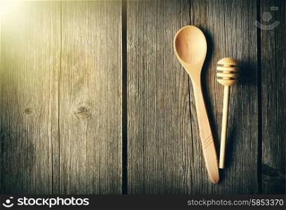 Wooden spoon and dipper on table