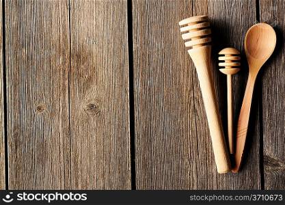 Wooden spoon and dippers on table