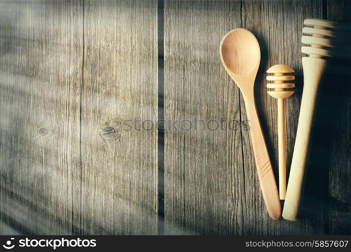 Wooden spoon and dippers on table