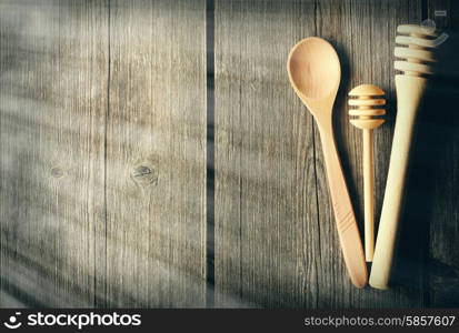 Wooden spoon and dippers on table