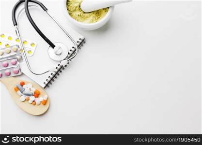 wooden spoon filled with pills top view copy space. Beautiful photo. wooden spoon filled with pills top view copy space