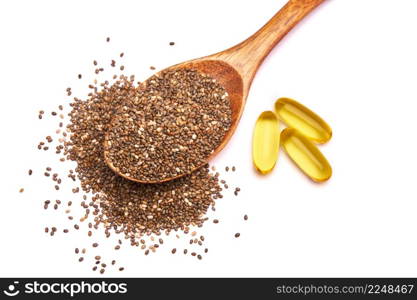 Wooden spoon full of organic natural chia seeds and and omega pills close-up. High quality photo. Wooden spoon full of organic natural chia seeds and and omega pills close-up