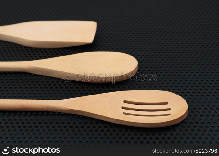 wooden spoon is handmade on a dark background