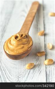 Wooden spoon of peanut butter