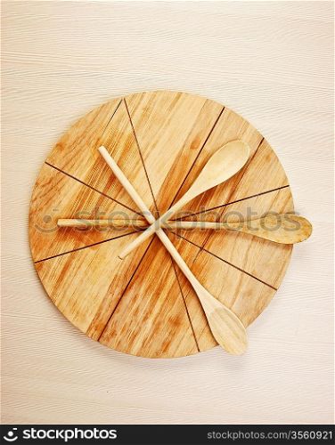 wooden spoon on cutting board