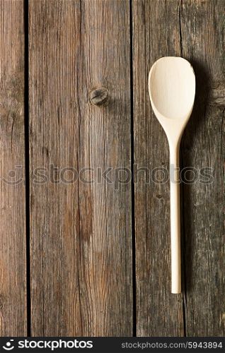 Wooden spoon on rustic background