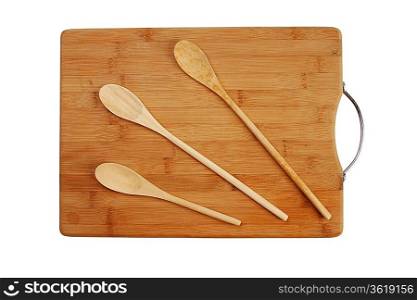 wooden spoon on the kitchen bamboo cutting board isolated on a white background