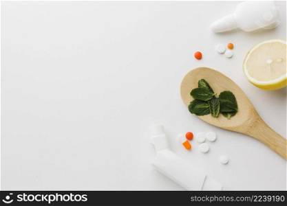 wooden spoon with herbs pills