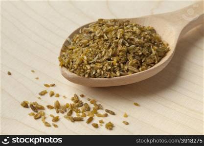 Wooden spoon with roasted Freekeh