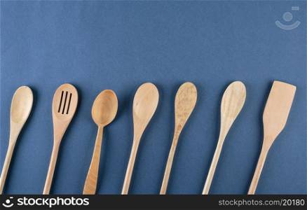 wooden spoons on a blue background