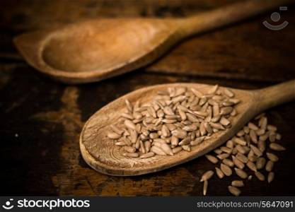 Wooden spoons with sunflower seeds