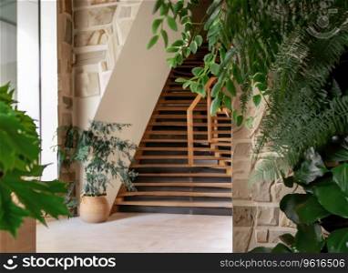 Wooden staircase and stone cladding wall in rustic hallway . Cozy home interior design