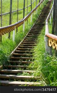 wooden staircase leading up the hill
