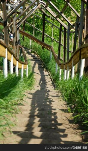 wooden staircase leading up the hill
