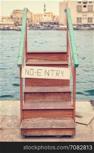 Wooden staircase with no entry sign. Conceptual image.