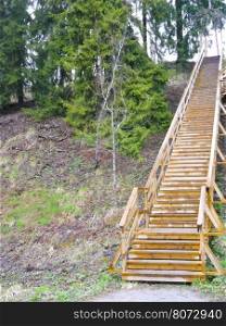 wooden staircase. wooden staircase goes up the hill