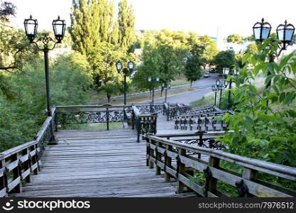 wooden stairs in the city park. wooden stairs in the city park with lanterns