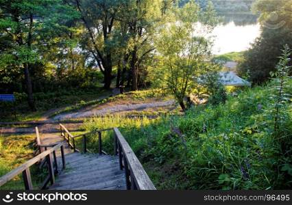 wooden stairs in the countryside in summer. wooden stairs in the countryside in summer, Russia