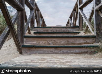 Wooden stairs in the dunes on the beach