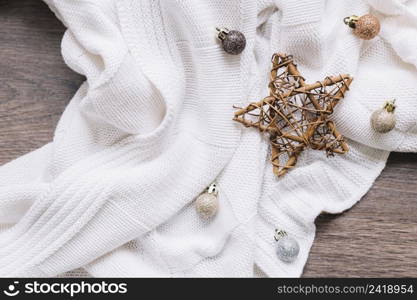 wooden star with shiny baubles table