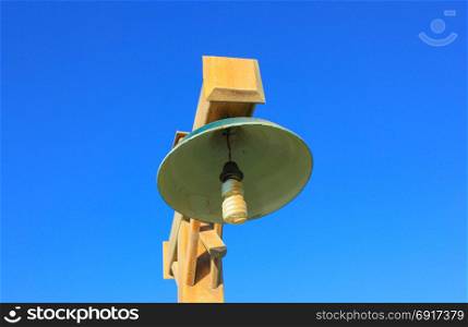 Wooden striit lamp. Wooden striit lamp on blue sky background