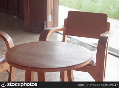 Wooden table and chairs in coffee shop, stock photo
