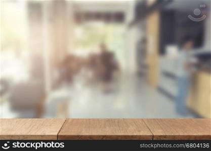 wooden table for display or montage your product with blur background of people in cafe coffee shop