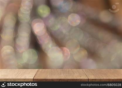 wooden table for display or montage your product with blur background of white bokeh light for abstract