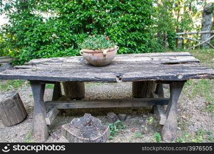 wooden table in the backyard of a country house