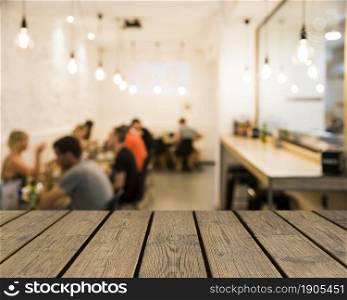 wooden table looking out people mensa. Beautiful photo. wooden table looking out people mensa