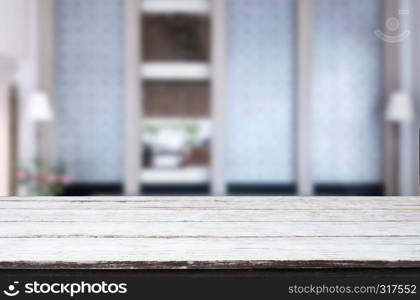 Wooden table on abstract blurred interior background and free space for your decoration display or montage your products.