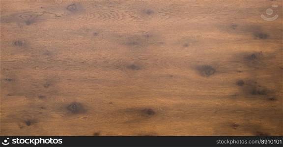 Wooden table top in dark timber . Aerial or above shot of a dark wooden table top with timber and knots. Wooden table top in dark timber 
