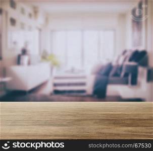 wooden table top with blur background of modern bedroom interior
