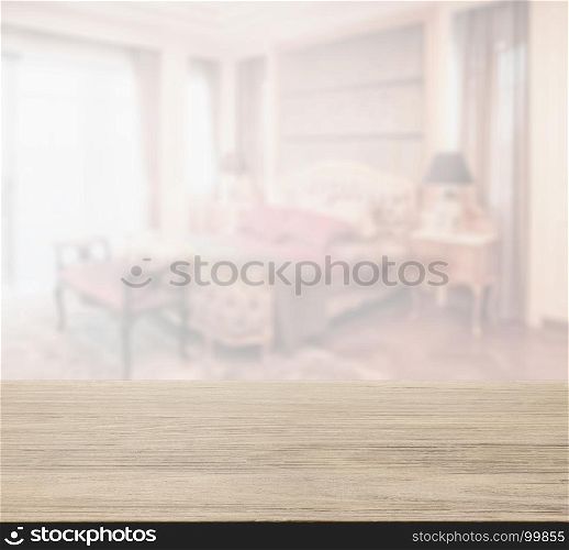 wooden table top with blur of bedroom in classic style interior