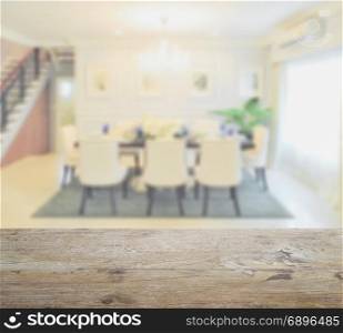 wooden table top with blur of classic style dining table in the dining room
