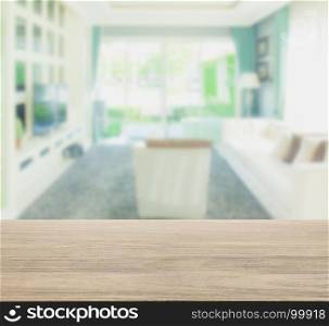 wooden table top with blur of living room in modern classic style