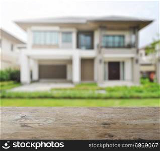 wooden table top with blur of modern building as background