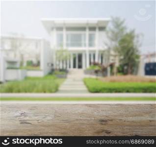 wooden table top with blur of modern building as background