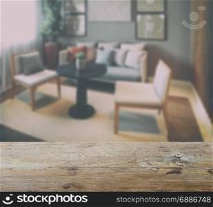 wooden table top with blur of simply style living room interior
