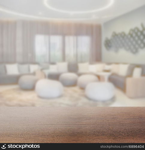 wooden table top with blur of waiting area at lobby or lounge