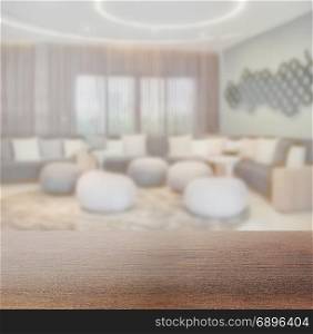wooden table top with blur of waiting area at lobby or lounge