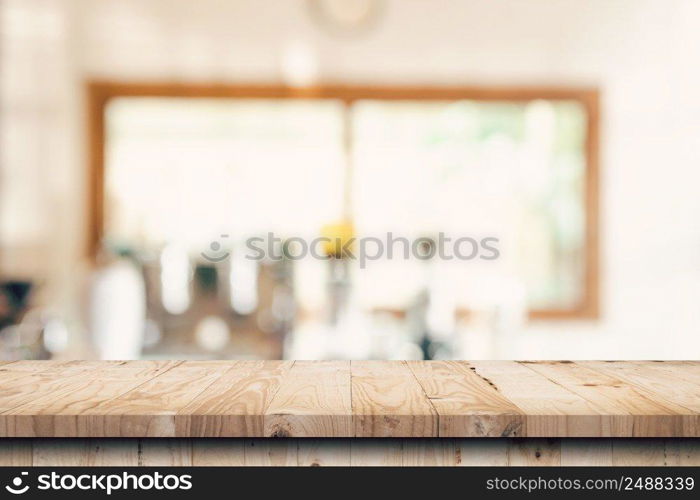 Wooden table top with blurred people in coffee shop and cafe background for display montage, copy space.