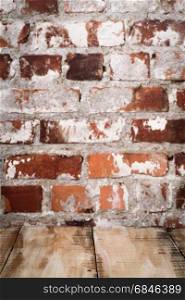 Wooden table top. Wooden table top with Red brick wall background.