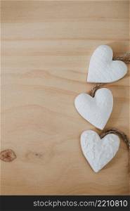wooden table with a bouquet of flowers and a white heart