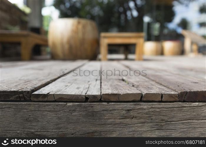 wooden table with background of chair and table on terrace patio
